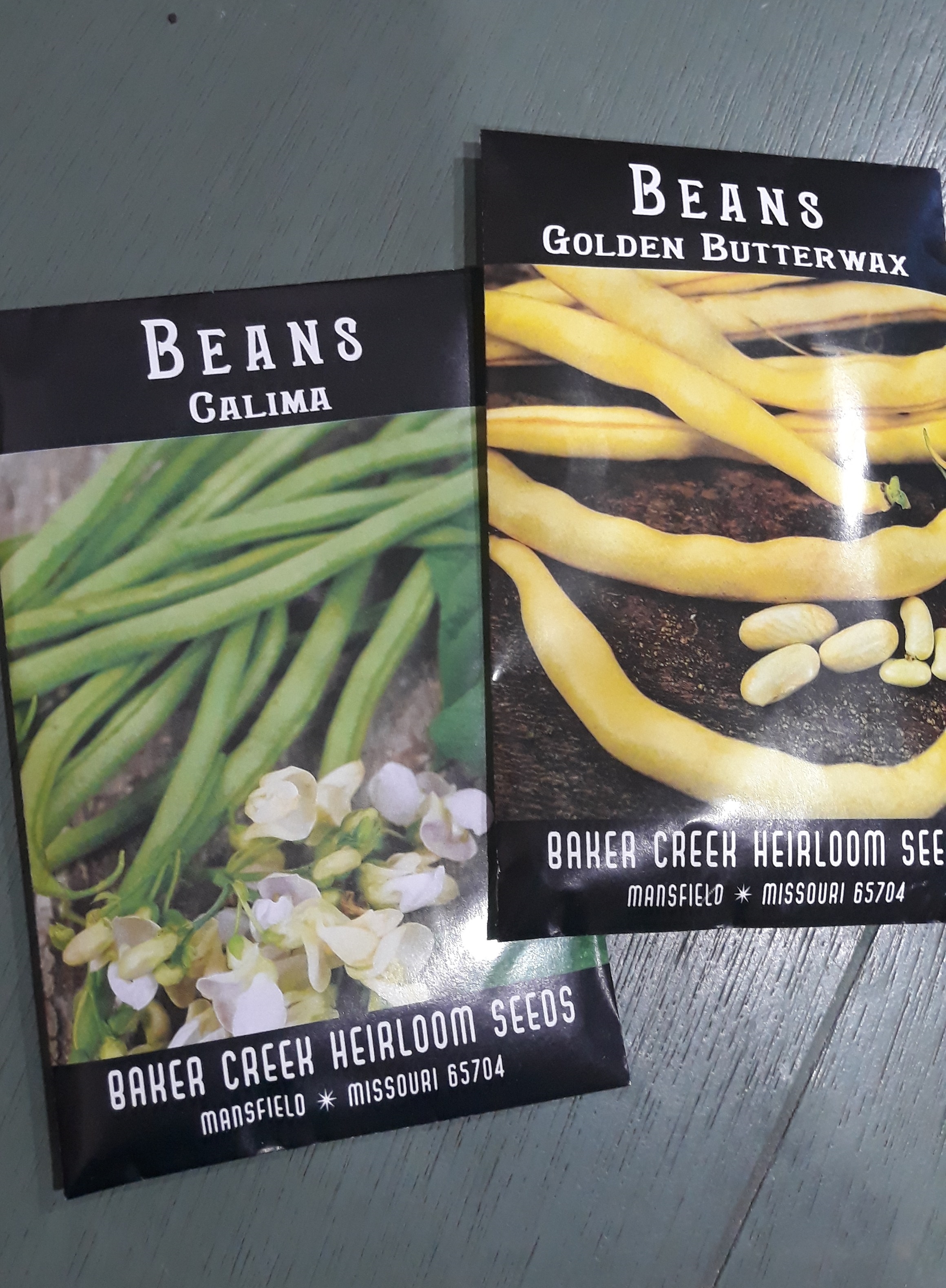 Two seed packets for Calima and Golden Butterwax beans from Baker Creek