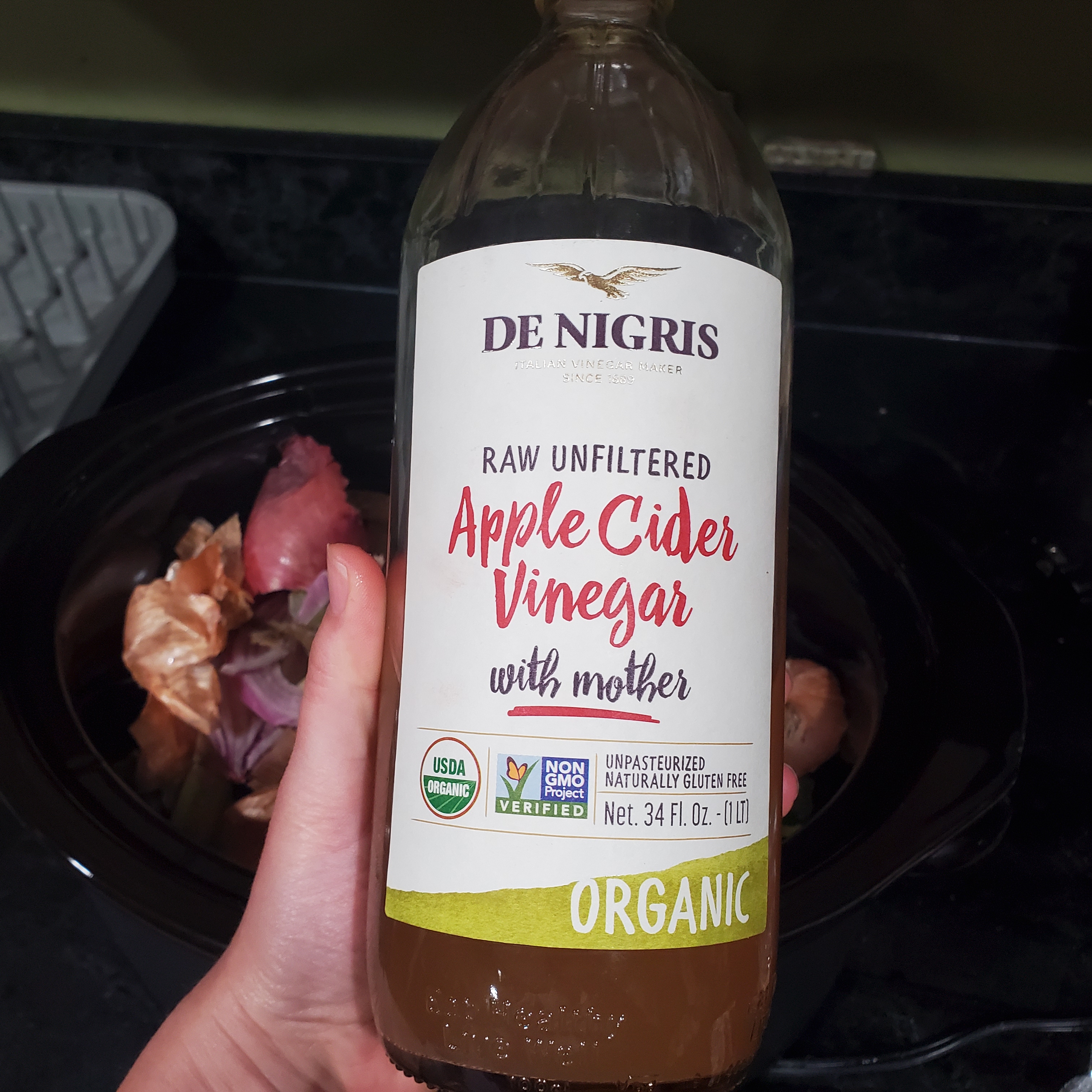 34 ounce glass bottle of De Nigris Apple Cider Vinegar