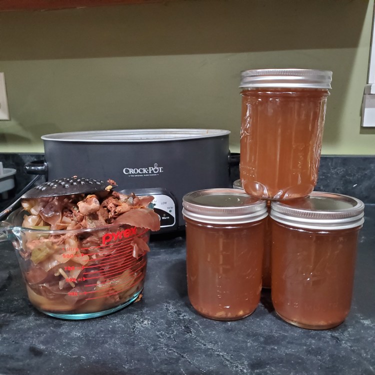 Finished chicken broth in mason jars