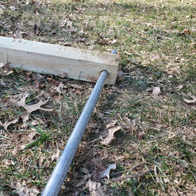 The first post connected to the galvanized tubing from the side angle