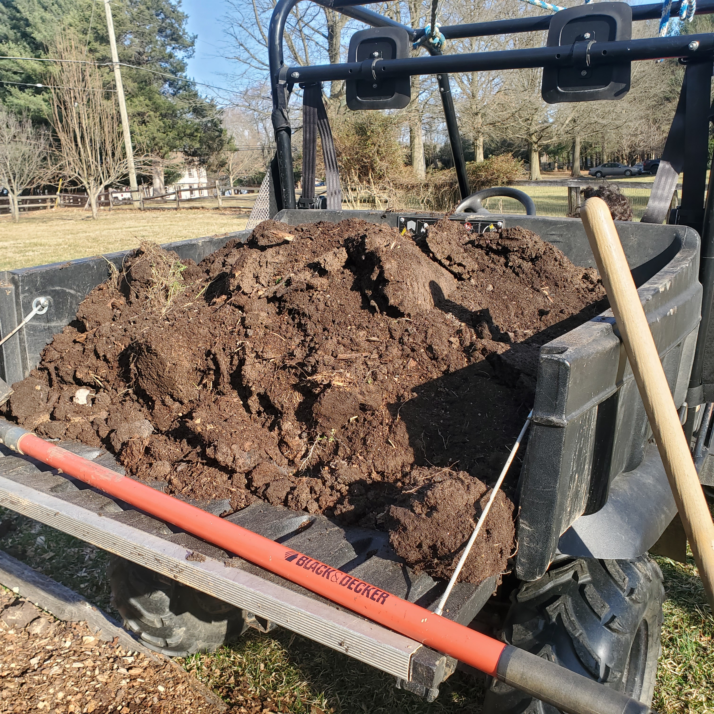 Compost soil filling the bed of the buggy