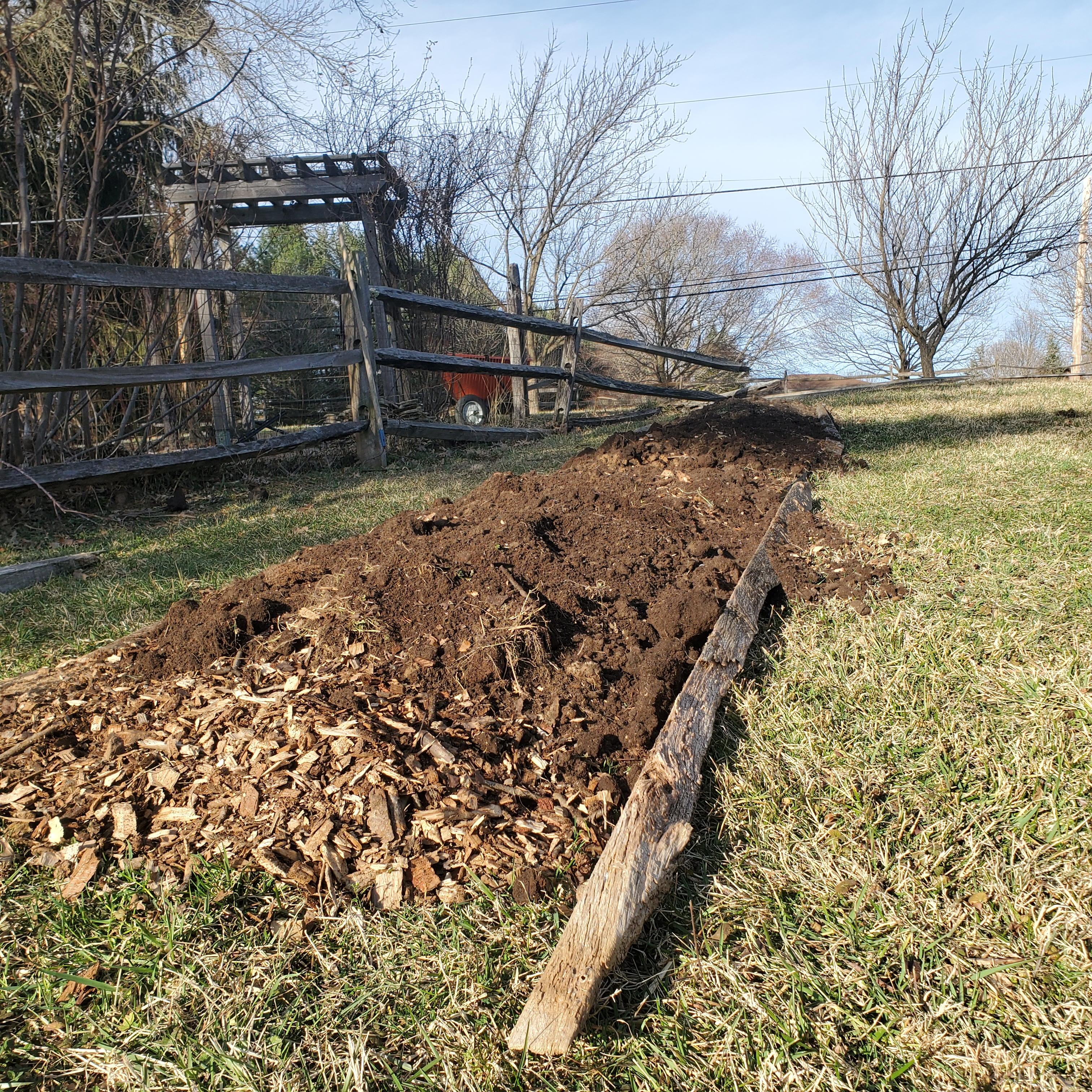 Adding the compost soil to the raised row