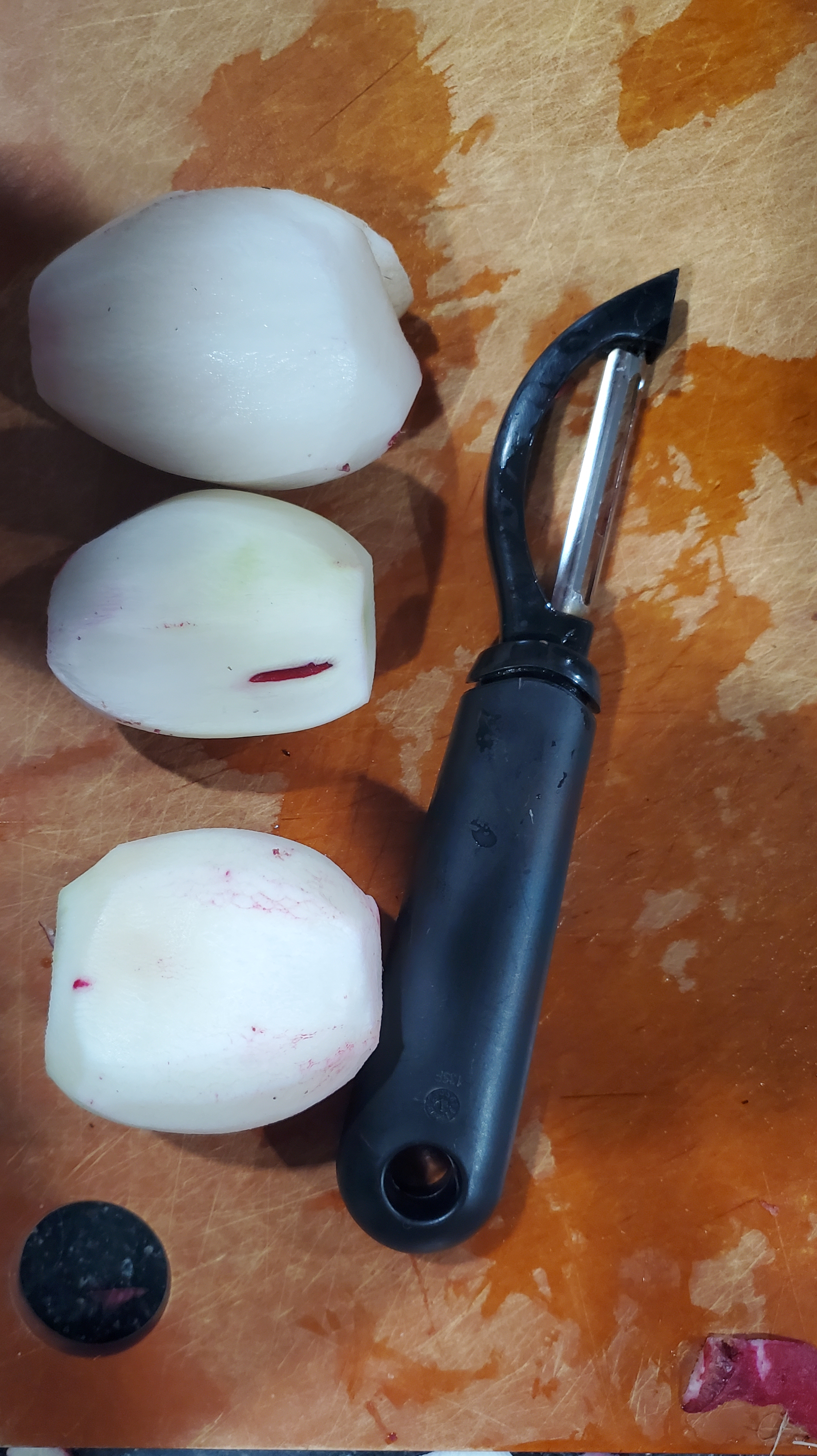 three cleaned radishes ready for chopping